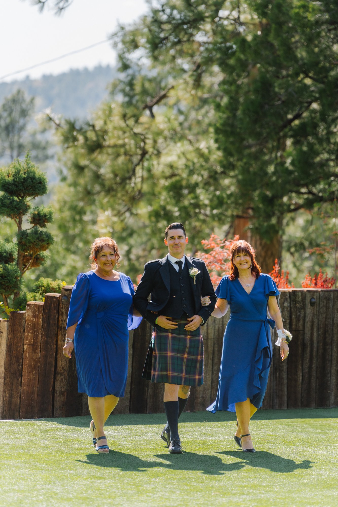 Mountain wedding processional, bride's mother and groom walking down the aisle at Tahquitz Pines, Idyllwild